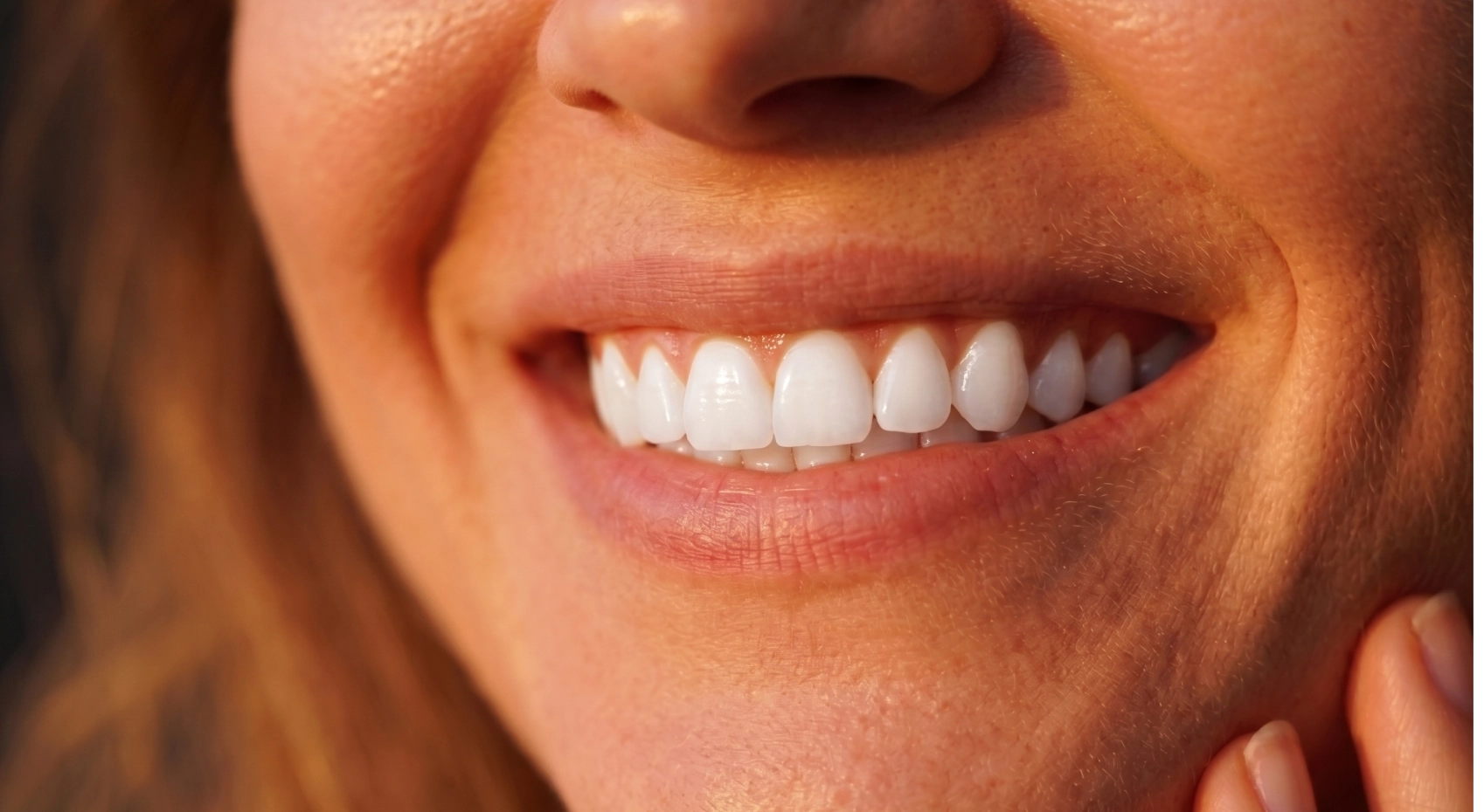 A group of people smiling with bright white teeth